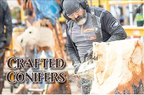 Chainsaw carver Adrian Bois works on transforming a plain old chunk of pine into an one-of-a-kind masterpiece.