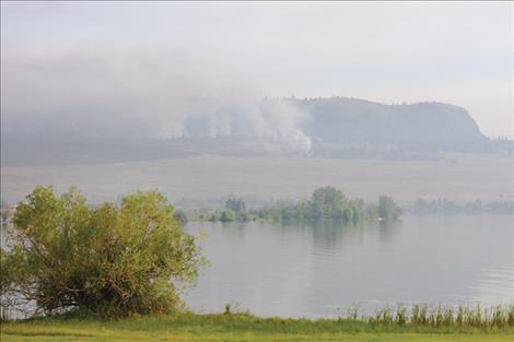 The Elmo Fire burns Saturday morning on the hillside north of Elmo.