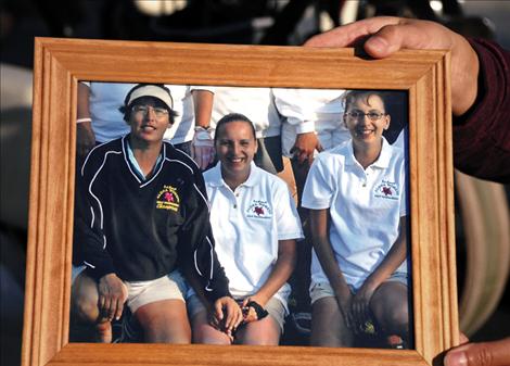 A photo shows Susie and her daughters at a golf tournament soon after Mary Ann’s, center, baby was born. 