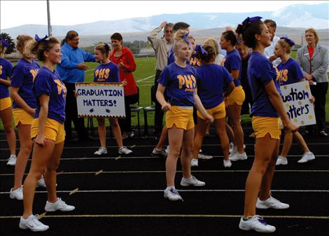 Polson cheerleaders are out in force in purple and gold for the Graduation Matters Kickoff.