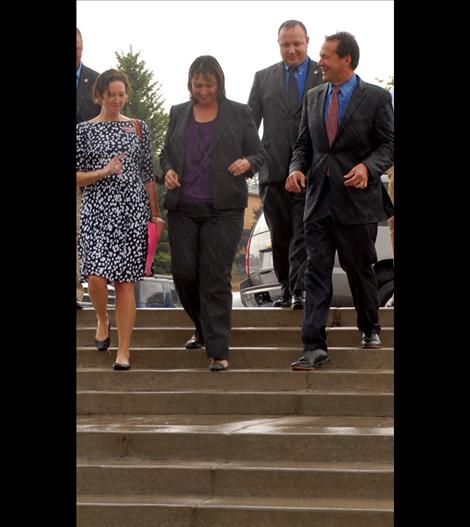 A rain soaked Superintendent Denise Juneau and Governor Steve Bullock head to Polson High School to interact with students and staff.