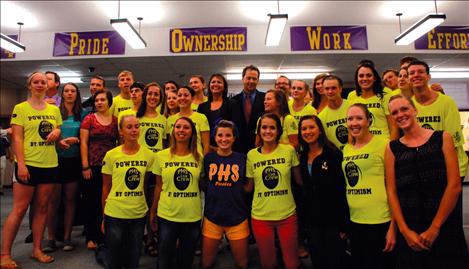 The PHS Link crew, in neon yellow shirts, stand with Governor Steve Bullock and Superintendent Denise Juneau.