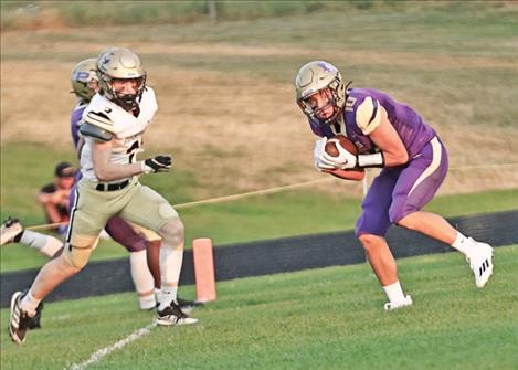 Tyler Wenderoth makes a catch during Polson’s Sept. 2 home game against Stevensville. The Pirates routed the Yellow Jackets 49-0. 