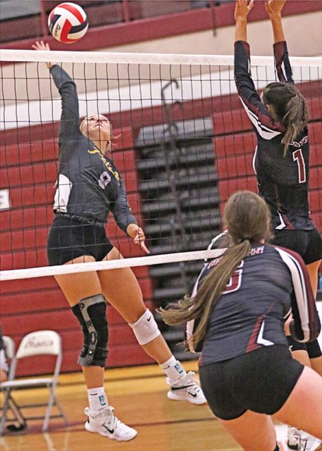 Lady Pirate volleyball player Clara Todd hits one over the net during a match-up with Hamilton. The Lady Pirates won one, lost one game to the Broncs.