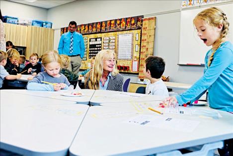 First Lady Susan Gianforte talks to a first-grade student at Townsend Elementary School.