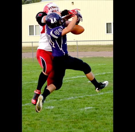 Defensive back Jesse Long breaks up a pass attempt by the Noxon Red Devils early in the first quarter of Friday’s 60-0 trouncing.