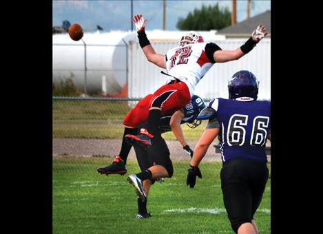 Charlo's Tristan Santee and Noxon's Oliver Grupenhoff collide after a failed pass attempt.