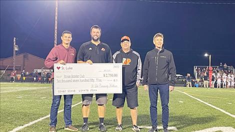 St. Luke Providers, Jesse Alfiero PA-C and Rob Alfiero PA-C, presented the 2022 sports donation to the Ronan Booster.