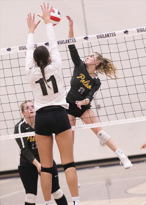 Polson Lady Pirate Lucy Violett slams a kill over the net during divisional tournament play last weekend. The Lady Pirates claimed the divisional title and will enter the state tournament as the top Western A seed. 