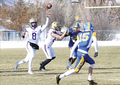 Pirate quarterback Jarrett Wilson passes for positive yards in Lewistown on Saturday afternoon.