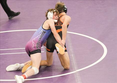 A Mission-Charlo wrestler grapples with an opponent during last weekend’s Owen Invitational wrestling tournament in Polson.