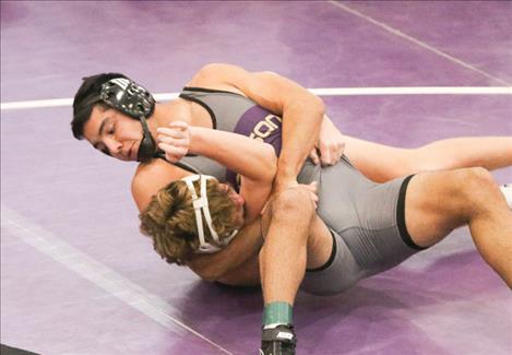 Polson Pirate wrestler Jaren Keene puts his opponent in a lock at Polson’s Owen Invitational. 