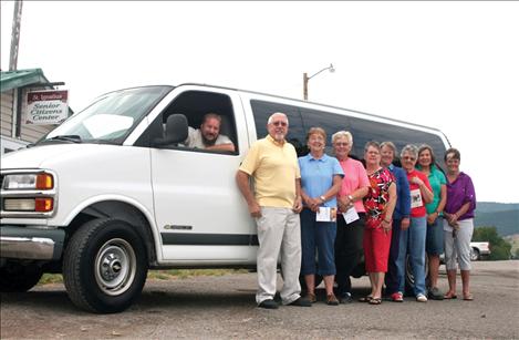 St. Ignatius Senior Center board members accept a van donated to the center by the Lower Flathead Valley Community Foundation for the Meals on Wheels program, to get people to medical appointments and for area trips. Pictured from left are Patrick McGreevey, Meals on Wheels driver; Mack McConnell, Senior Center board president; Lois Delaney, Senior Center board member; Lila Faye Krantz, Senior Center board member; Kay Kelly, Senior Center board member; Mary Stranahan, LFVCF board member; Ruth Krantz, Senior Center board member; Germaine White, LFVCF board president; Carlene Bockman, program officer for the LFVCF.