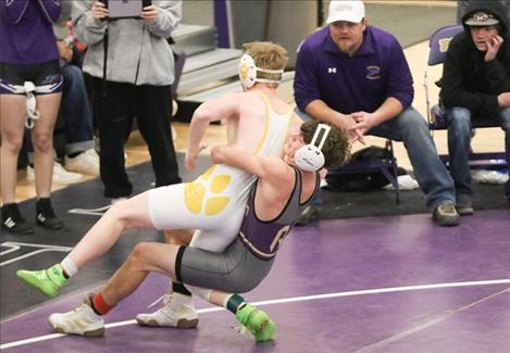 Polson Pirate Daniel O’Roake works to take down a Whitefish wrestler.