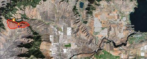 The West Garcon fire, also called the West Garceau fire, is burning roughly 15 miles west of Polson as seen in the red area of the map.