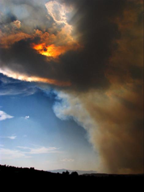 Smoke from the West Garcon fire blots out the sun Aug. 14 in this photo taken near the Polson High School sports complex.