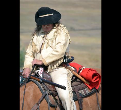 Don Clauson, assistant fire chief for Rollins Volunteer Fire Department, dressed in buckskin and rode his horse through the parade route.