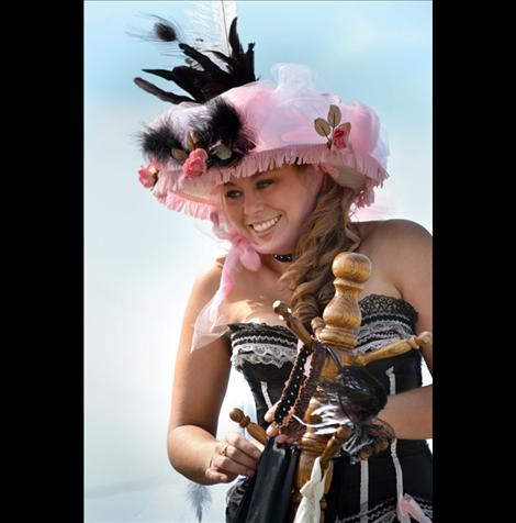 Kelly Jensen prepares to ride through town on her horse. She and friend Nancy Riggio took top honors in the horses parade catagory.