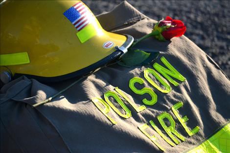 A rose of remembrance sits atop firefighter's turnouts in honor of New York firefighters who gave their lives trying to save people from the Twin Towers attack.