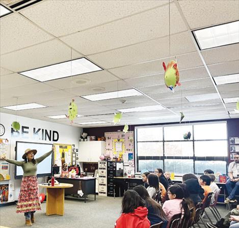  Aspen Decker teaching Plains Sign Language to fourth graders at Pablo Elementary