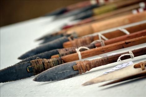 Above, points made by flint knapper Don Safford are fashioned into arrows. 