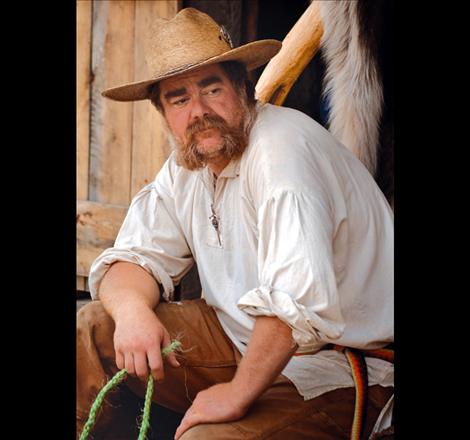 Phil Peck takes a break from creating rope out of sisal.