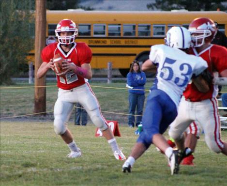 Warriors’ quarterback Riley Rogers looks for an open receiver.