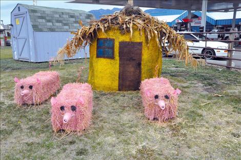 Mountain West Co-op created three little pigs and a straw shack for their entry into the round bale contest at the Ronan Harvest Festival.