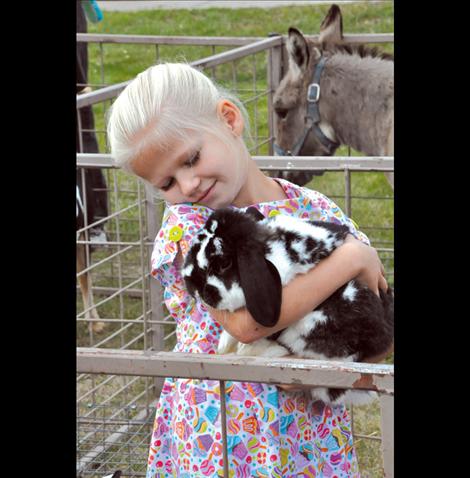 Shaelyn Kohn cuddles a bunny at the Ronan Harvest Festival.