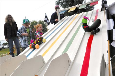 Zucchini racers built by Vivian and Ella Grainey steam down the track.