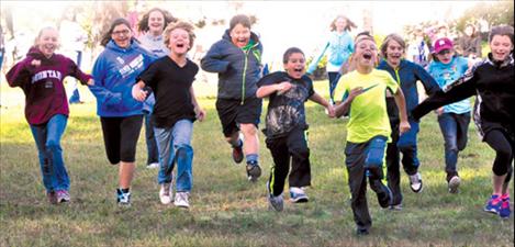 Students play “Scream and Run," a game meant to build endurance. 