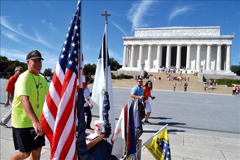 With less than half a mile to go on his 3,300-mile journey, Lewis passes by the Lincoln Memorial in Washington, D.C.
