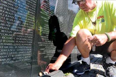 At Marine Sgt. Chuck Lewis’ final destination, the Vietnam Veterans Memorial Wall, he placed several objects at the request of folks he met along the way; a dreamcatcher, challenge coins, and even a shell casing containing the ashes of a veteran who passed away in 2011. He then made a pencil rubbing of a Ridgecrest, Calif., classmate who was killed in battle during the 1960s.