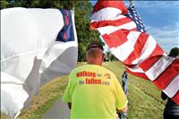 Lewis finishes walk for the fallen