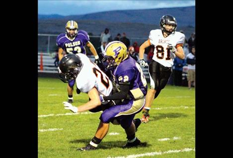  Tyler Dupuis stops a Frenchtown runner in his tracks.